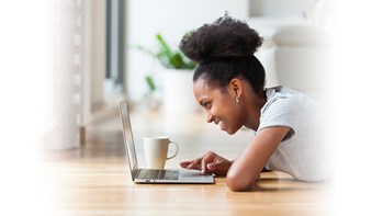 Girl laying on the floor with her laptop