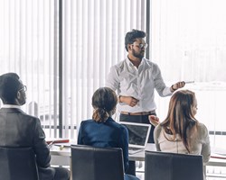 Group of business professionals around a meeting table