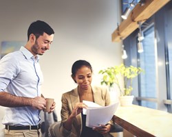 Two professionals reviewing a document