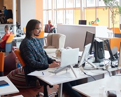 Professionals working in open plan office