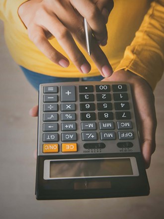 Close up of a student using a calcuator