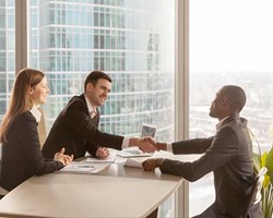 Modern professionals shaking hands