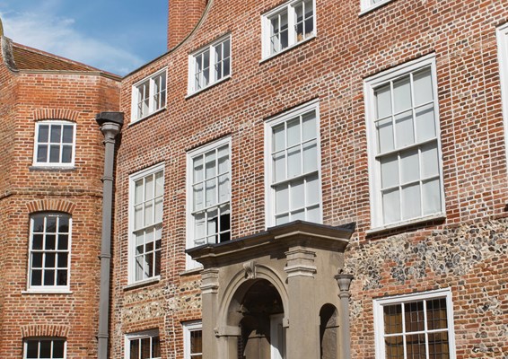 Sunny exterior of Earlham hall at the University of East Anglia