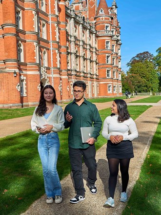 Students walking outside Royal Holloway Law School