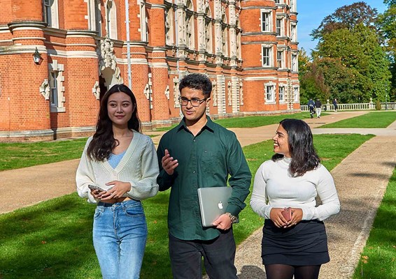 Students walking outside Royal Holloway Law School