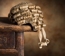 Barristers wig on a wooden desk