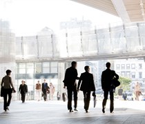 Business professionals walking around modern office space