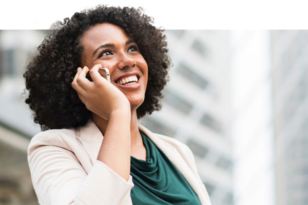 Smiling woman on her mobile 