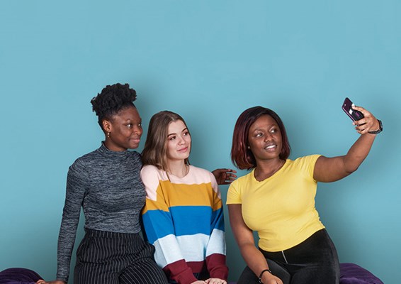 three students taking a selfie