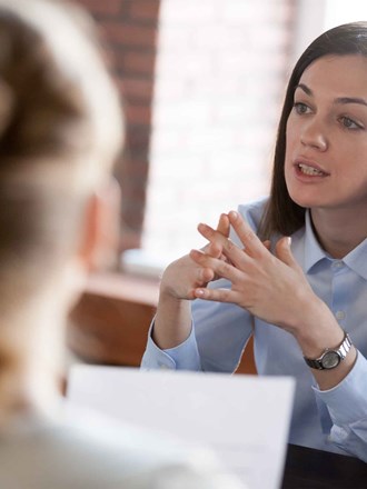 Woman talking with others